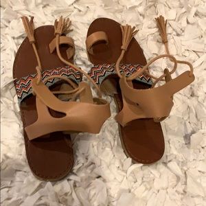 Brown sandals with colorful chevron and fringe tie